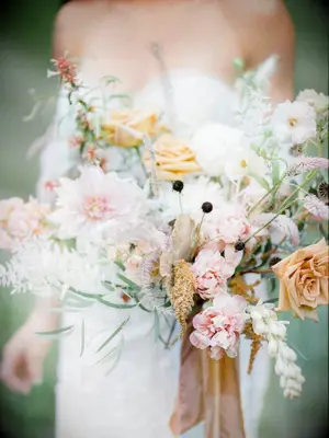 Orange-hued wildflower wedding bouquet