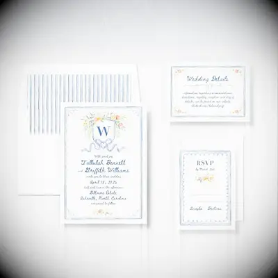 White and blue wedding invitations with floral accents