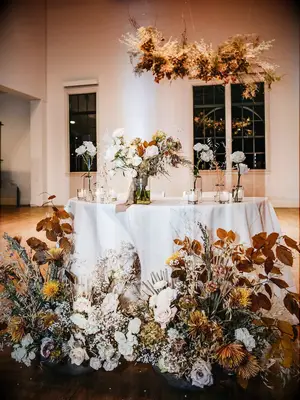 Boho sweetheart table with muted rustic wedding flowers