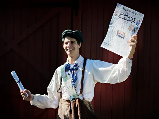 Newspaper-themed wedding programs