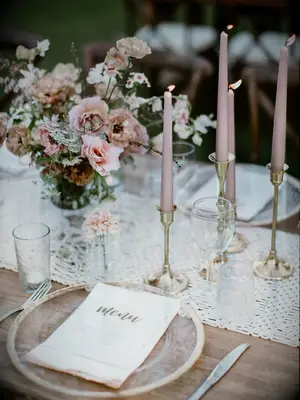 romantic fall wedding centerpiece with blush taper candles, gold candle sticks and macrame table runner
