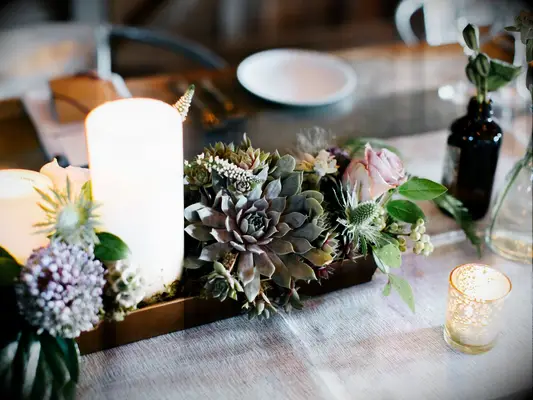 succulent fall wedding centerpiece with votive candles 