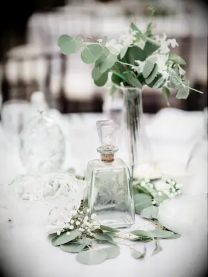 simple fall wedding centerpiece with silver dollar eucalyptus and baby