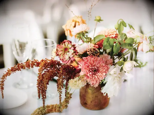 fall wedding centerpiece with dahlias and amaranthus in copper vase