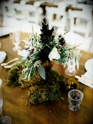 moss, greens and leaves fall wedding centerpiece