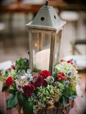 lantern fall wedding centerpiece with candles and red roses