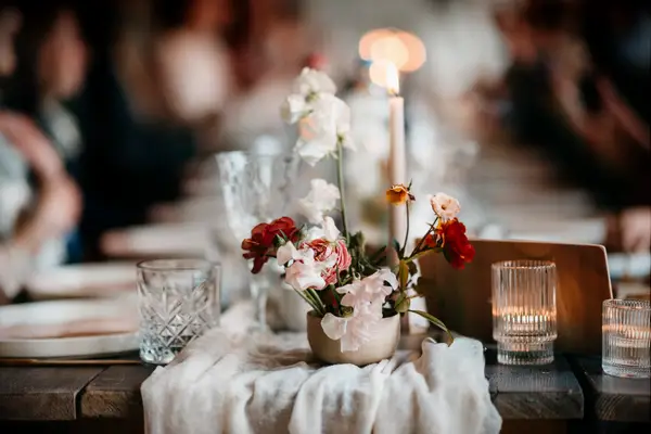 Flowers and candle tablescape decor