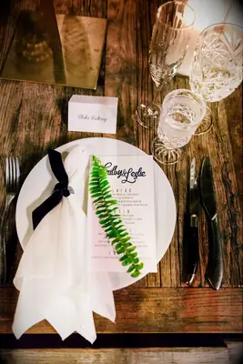 Wood Table, White Place Setting and Fern Leaf