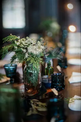 Glass Centerpieces With Cedar and Baby