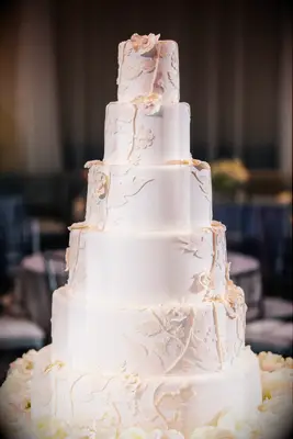 Ivory Wedding Cake With Floral Cutouts
