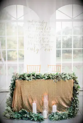 Gold Sequin Sweetheart Table with Lush Green Garland