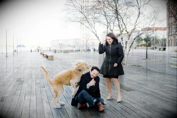 Funny candid moment between a couple and their dog.