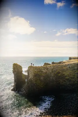 Cliffside destination engagement photo ideas