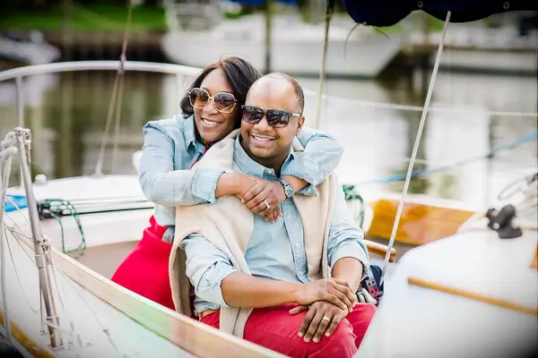 Couple shares hug during nautical boat engagement photo shoot
