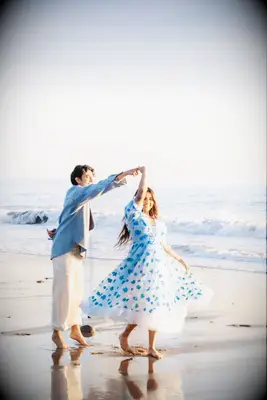 Dancing on the beach engagement photo