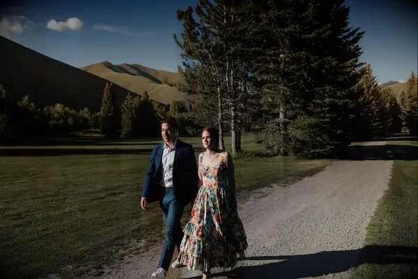 Walking near the mountains engagement photo