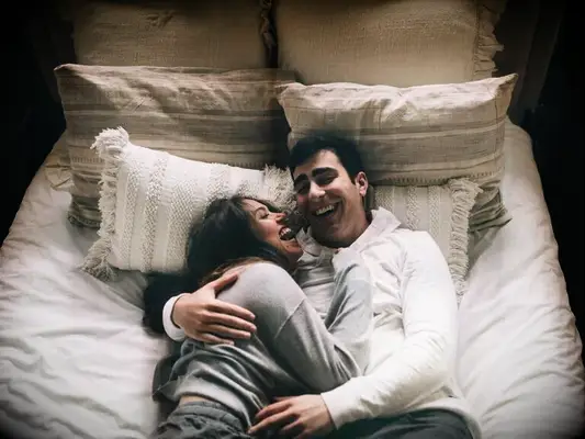 Sweet and candid engagement photoshoot in bed