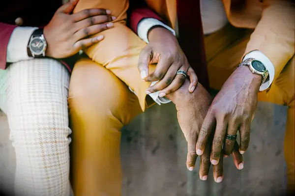 Close up of engagement rings on couple