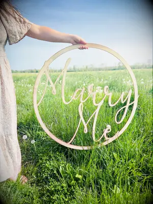 Wooden marry me engagement sign