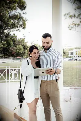 Couple watching proposal on tablet