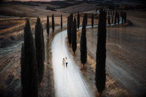 Couple walking on an empty road