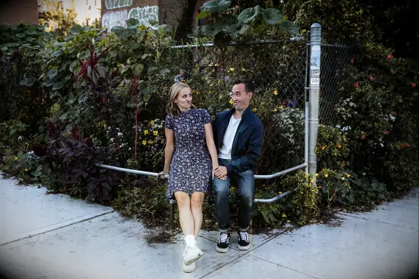 Couple looks at each other while making silly faces. 