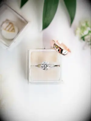 Round-cut solitaire diamond engagement ring on white gold band