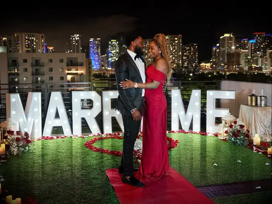 Couple standing in front of 