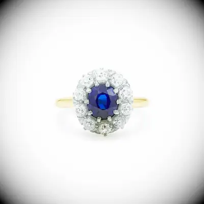 Edwardian sapphire and diamond cluster engagement ring