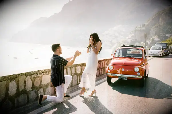 Romantic couple proposal on italian street by water