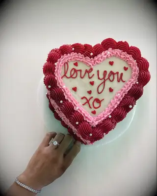 engagement ring selfie with heart cake
