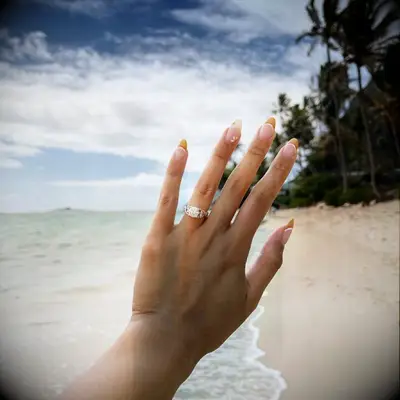 Engagement ring selfie on the beach