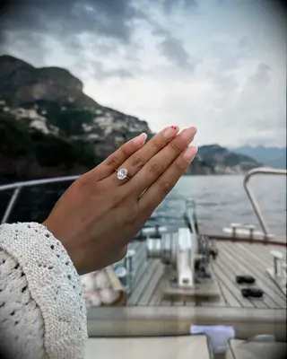 Engagement ring selfie on a boat on the water