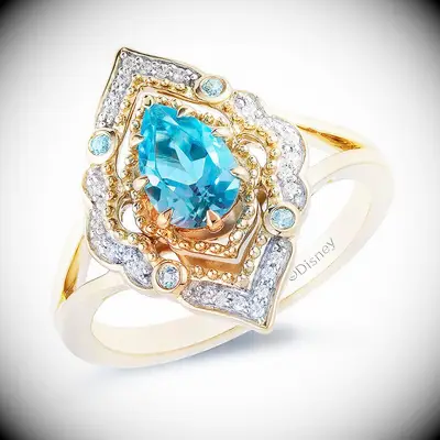 Aladdin pear-shaped engagement ring with gold band