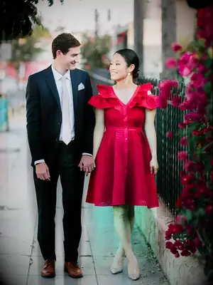 Couple in formal attire holding hands