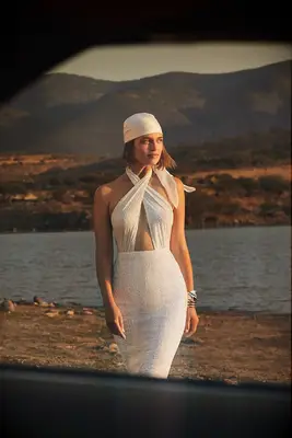 sequin fitted gown with criss cross halter and cutout