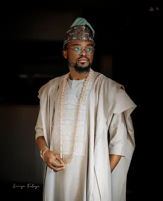 Man wearing beige traditional attire