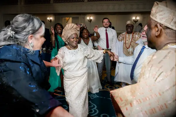 Guests dancing and holding hands