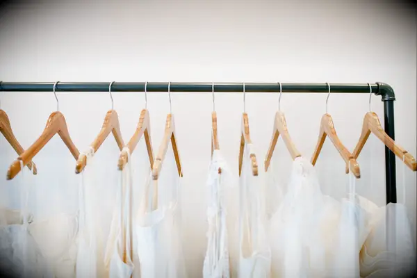 Rack of wedding dresses on hangers