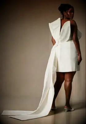 White plus size mini dress with bow and draped train on back for courthouse wedding