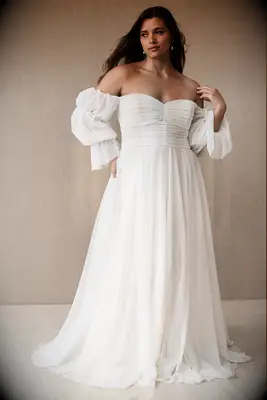 Off the should white wedding dress by Anthropologie. 