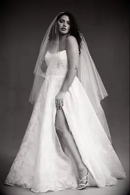 Strapless plus sized wedding dress by Jenny Yoo. 