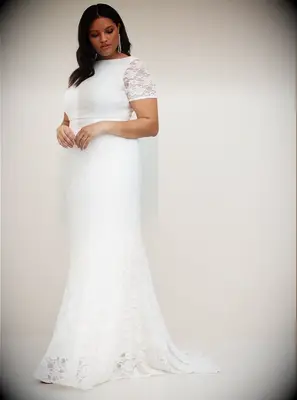 Lacy plus-size wedding dress by Torrid. 