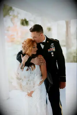 Couple with husband in military attire on their wedding day