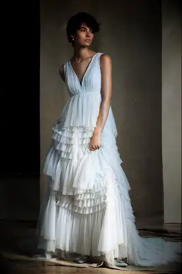 Pale blue tiered wedding dress by Anthropologie, best pastel wedding dress 2023. 