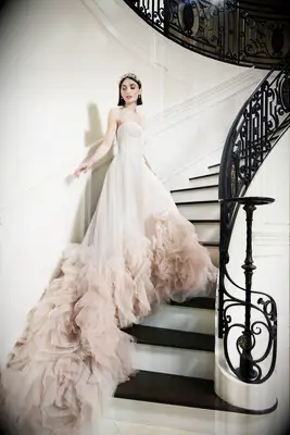 Strapless soft pink wedding dress, best pastel wedding dresses 2023. 