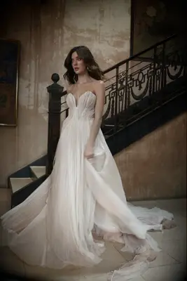 Strapless blush gown, best pastel wedding dresses 2023-2024. 