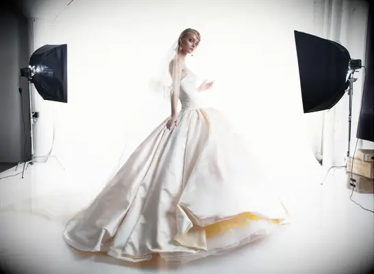 Strapless pale yellow gown with matching veil. 