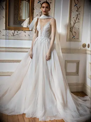 Galia Lahav embroidered wedding gown with cape that forms a sparkly tulle bow