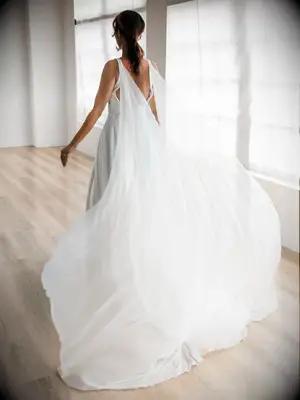 Rebecca Schoneveld flowy wedding cape made with georgette fabric